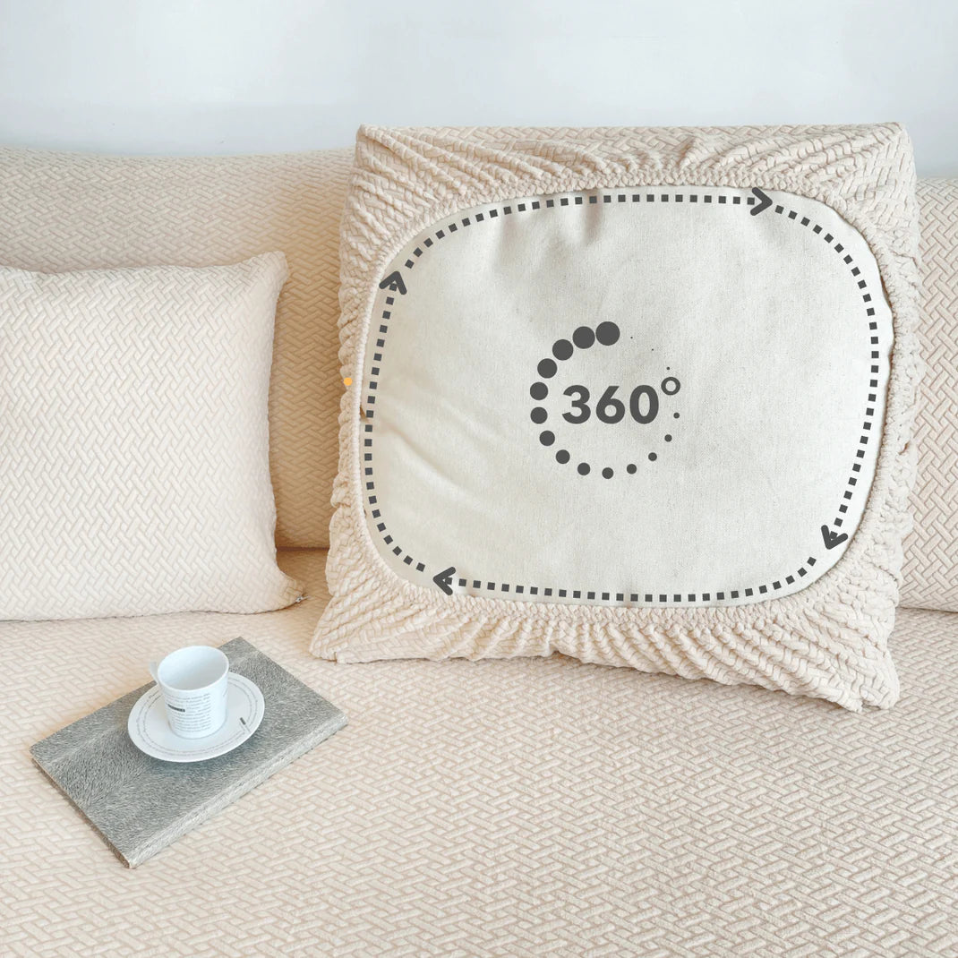 Cream textured pet-friendly pillow cover on a sofa, illustrated with a dashed black outline and arrows indicating 360° full wrap-around coverage, featuring a 